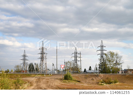 View of power lines near residential buildings. Electricity. View of power lines near residential buildings. Electricity. 114061255