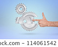 Interlocking silver gears with human touch 114061542