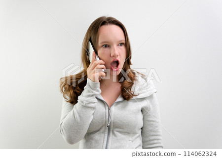 woman with mobile phone, over white background woman with mobile phone, over white background 114062324