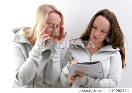 businesswoman looking at documents together 114062364