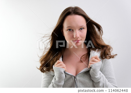 Beautiful young caucasian girl wearing casual sweatshirt hugging oneself happy and positive, smiling confident. self love and self care 114062448