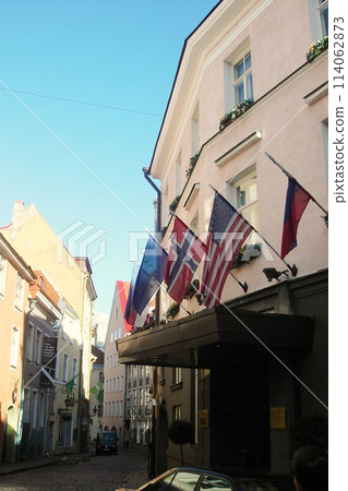 Historical houses on cobbled street in old town. The medieval architecture of small walkway in empty streets and alleys. Detail of buildings in narrow lane. Tallinn, Estonia - November 2, 2008 114062873