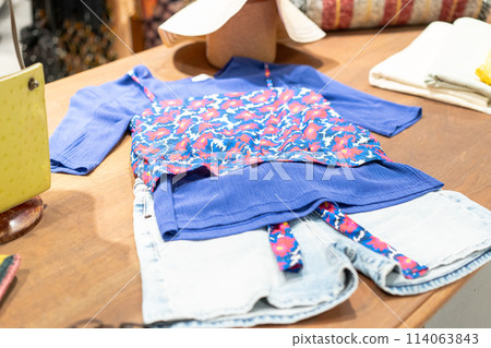 Clothes lined up in a store Clothes lined up in a store 114063843