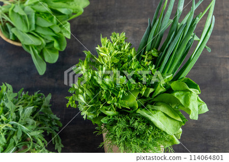Green onions, spinach, parsley and dill. Vitamin food. Prepare greens salad. Green onions, spinach, parsley and dill. Vitamin food. Prepare greens salad. 114064801