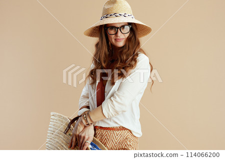 happy elegant woman in blouse and shorts isolated on beige 114066200