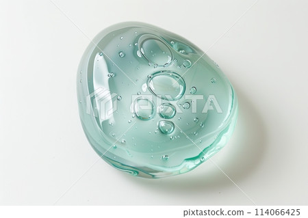 Gel. Green gel texture with bubbles swoosh swatch sample cosmetics. Cosmetic product close up. Facial jelly serum, cleanser, shower gel or shampoo. Transparent drop isolate on white background. Liquid Gel. Green gel texture with bubbles swoosh swatch sample cosmetics. Cosmetic product close up. Facial jelly serum, cleanser, shower gel or shampoo. Transparent drop isolate on white background. Liquid 114066425