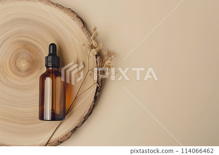 Dark amber glass bottle top view. Natural skin care SPA beauty product design. Mineral organic eco oil cosmetics on beige background. Mock-Up. Oily pipette. Face, body treatment. Flat lay, copy space 114066462