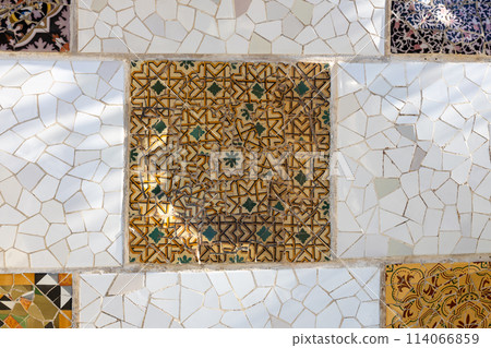 Colorful mosaic tiles at Guell Park. Broken tiles mosaic pattern. UNESCO World Heritage Site, Barcelona, Spain Colorful mosaic tiles at Guell Park. Broken tiles mosaic pattern. UNESCO World Heritage Site, Barcelona, Spain 114066859