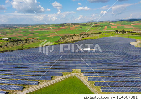 Rows of solar panels on the green meadow in Greece. Aerial view. 114067381