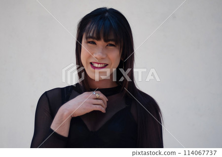 Portrait of Asian transgender women in black dress on white background Portrait of Asian transgender women in black dress on white background 114067737