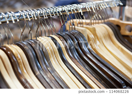 Empty wooden hangers 114068226