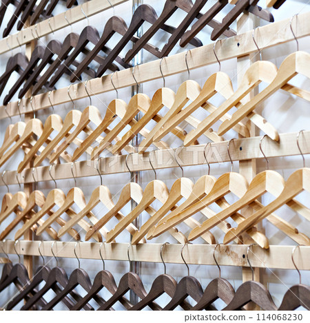 Empty wooden hangers 114068230