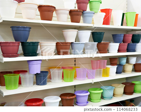 Plastic flower pots on counter in store Plastic flower pots on counter in store 114068233