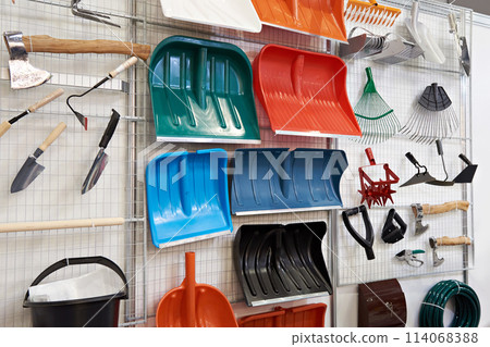 Plastic shovels and other household goods in store Plastic shovels and other household goods in store 114068388