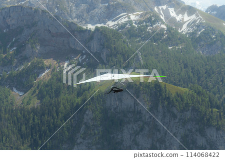 Hang gliding above mountain valley near Jenner mount Berchtesgaden National Park Hang gliding above mountain valley near Jenner mount Berchtesgaden National Park 114068422