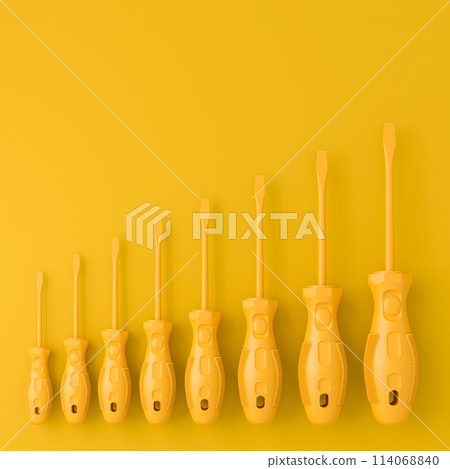 Set of monochrome screwdrivers on multicolor background 114068840