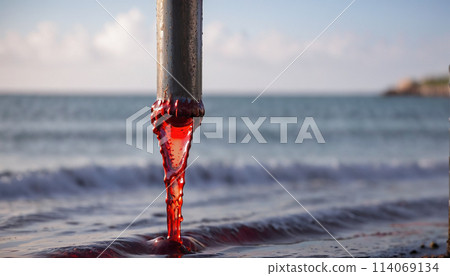 Conceptual illustration of a toxic liquid being discharged directly into the sea from an industrial plant or leaking from a faulty pipeline - ai generated 114069134