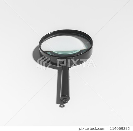 Office analysis with magnifying glass, zooming in on details. Quality inspection, crime study, Office analysis with magnifying glass, zooming in on details. Quality inspection, crime study, 114069225