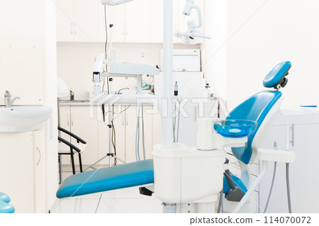 Dentist workspace with modern chair, equipment and instruments Dentist workspace with modern chair, equipment and instruments 114070072