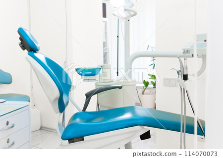 Dentist workspace with modern chair, equipment and instruments 114070073