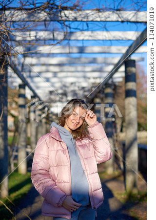 Winter Fun in Bitigheim-Bissingen: Beautiful Girl in Pink Jacket Amidst Half-Timbered Charm. a lovely girl in a pink winter jacket standing in the archway of the historic town of Bitigheim-Bissingen Winter Fun in Bitigheim-Bissingen: Beautiful Girl in Pink Jacket Amidst Half-Timbered Charm. a lovely girl in a pink winter jacket standing in the archway of the historic town of Bitigheim-Bissingen 114071019