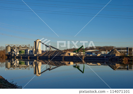 Riverside Manufacturing Hub. Eco-Friendly Technology and Production. industry and the environment, showcasing the integration of sustainable practices. 114071101