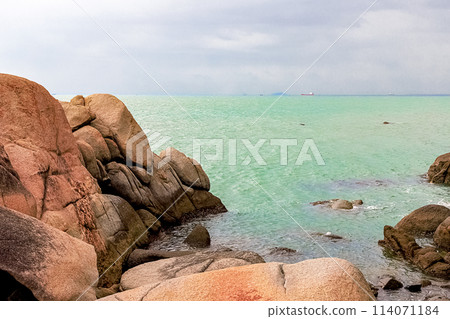 View of large rocks along the shore of the South China Sea. Sky Grottoes Park, Sanya, China 114071184