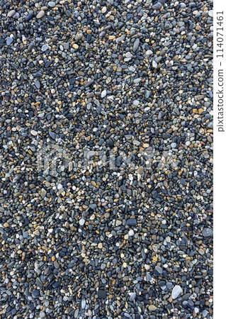 the texture of the pebbles in close-up as a background 114071461