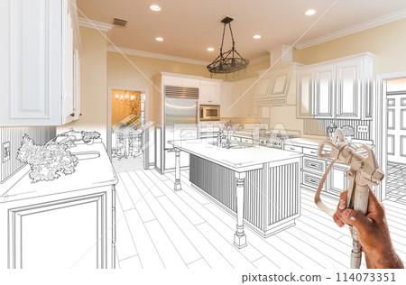 Professional Spray Painter Holding Spray Gun Spraying Renovated Kitchen Over Design Drawing. 114073351