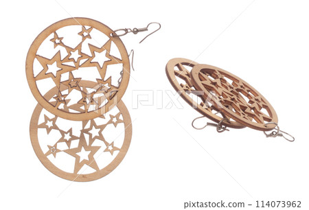 Fashion wooden Earrings with beautiful work detail is value. Luxury wooden star earring is fashion trend and fly in air. White background isolated 114073962