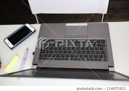 Computer on a desk at home 114075821