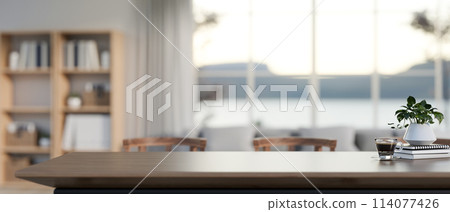 A display space to showcase your products on a wooden table in a modern living room. 114077426