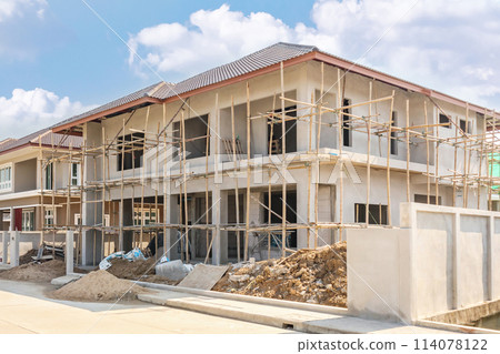 construction residential new house in progress at building site housing estate development 114078122