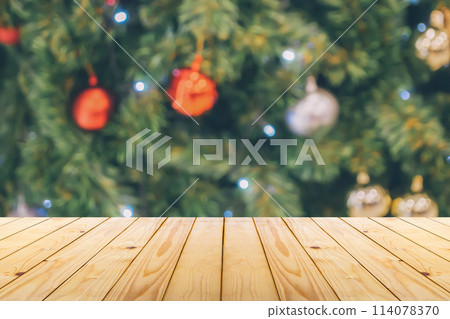 Empty wood table top with blur Christmas tree with bokeh light background 114078370