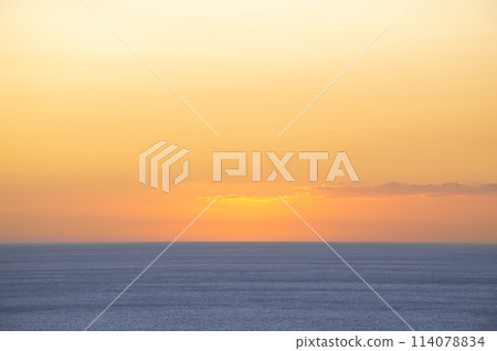 Sunset colors in the sky in the sea Sunset colors in the sky in the sea 114078834