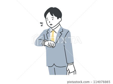 A busy businessman checking his watch 114078865