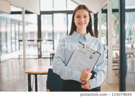 Asian young holding resume applying to apply for a job Asian young holding resume applying to apply for a job 114079684