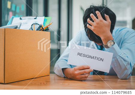 Young company employee stressed After resigning from work to find a new job , was fired by the company or when the employment contract expires, resulting in being unemployed 114079685