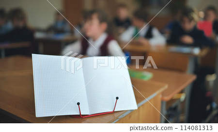 Notebook on a stand in the classroom during a lesson. Notebook on a stand in the classroom during a lesson. 114081313