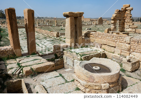 Round-shaped carved rock, Olive oil presses at archaeological site in roman ancient city Sufetula in Sbeitla in Tunisia 114082449