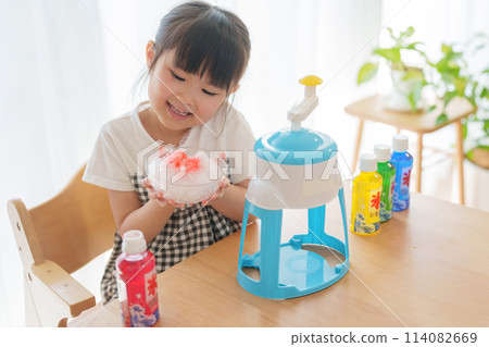 Child making shaved ice Child making shaved ice 114082669