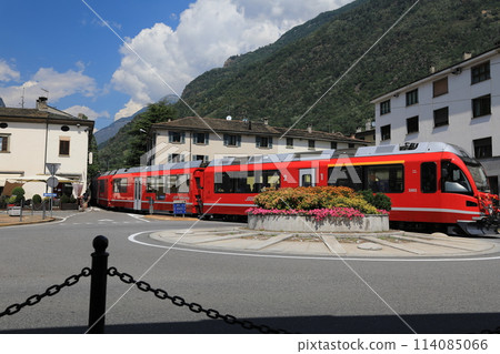 Bernina Express running through Tirano, Italy Bernina Express running through Tirano, Italy 114085066