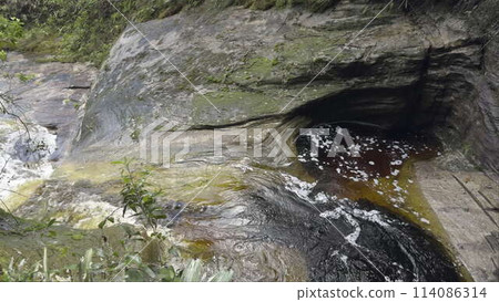 Blood-Red Water Pools in Stone Basin at Slow-Motion 114086314
