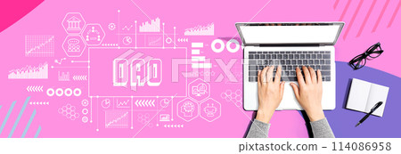 DAO theme with person using a laptop 114086958