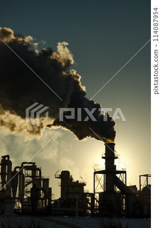 Smoking chimney  at sunset 114087954