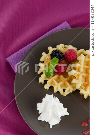 Tasty waffle with fruits 114088344
