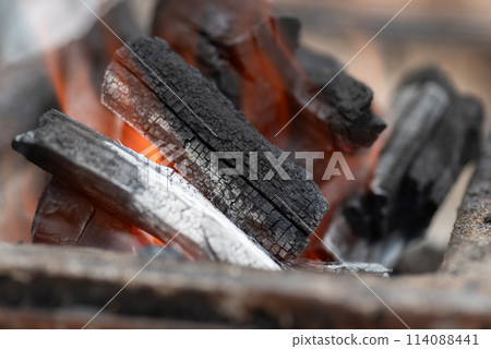 Burning charcoal Burning charcoal 114088441