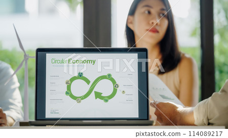 ESG ( environment, social,governance)  circular economy on laptop screen with carbon free chart board in office 114089217