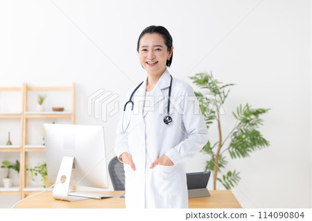 Middle-aged woman in white coat 114090804