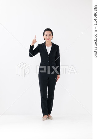 Business middle-aged woman standing pointing Business middle-aged woman standing pointing 114090868